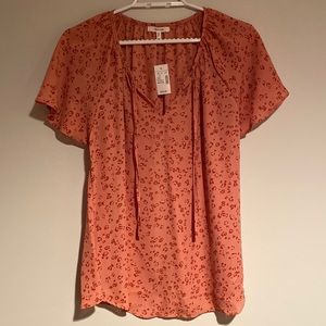 Maurice’s. Peach short sleeve ladies blouse. Size medium.